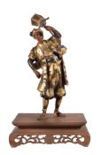Yoshimitsu: A Japanese Parcel Gilt Bronze Figure of a Night Watchman