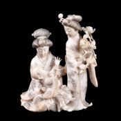 ϒ A Japanese Ivory Okimono of a kneeling Bijin