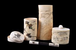 ϒ A Japanese Ivory Box and Cover of natural oval section decorated in high relief with a farmer