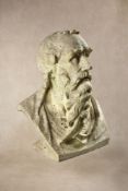 A sculpted white marble bust of a gentleman