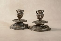 A pair of Venetian bronze candlesticks