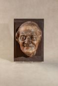 After Jean-Antoine Houdon, (French 1741 - 1828), a painted plaster visage of François-Marie Arouet d