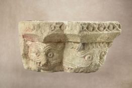 A sculpted limestone column corner capital