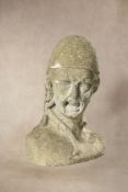 A sculpted limestone bust, possibly of a gorgon,