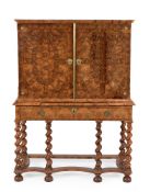 A Charles II walnut and olivewood oyster veneered cabinet on stand