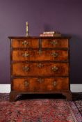 A George II walnut chest of drawers