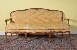 A Louis XV carved beech and upholstered sofa