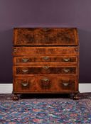 A William & Mary figured walnut and fruitwood strung bureau