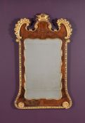 A George II walnut and parcel gilt wall mirror
