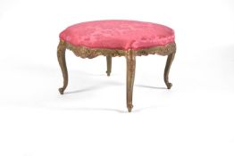 A Louis XVI style green painted and parcel gilt shaped circular stool, late 19th century, the red