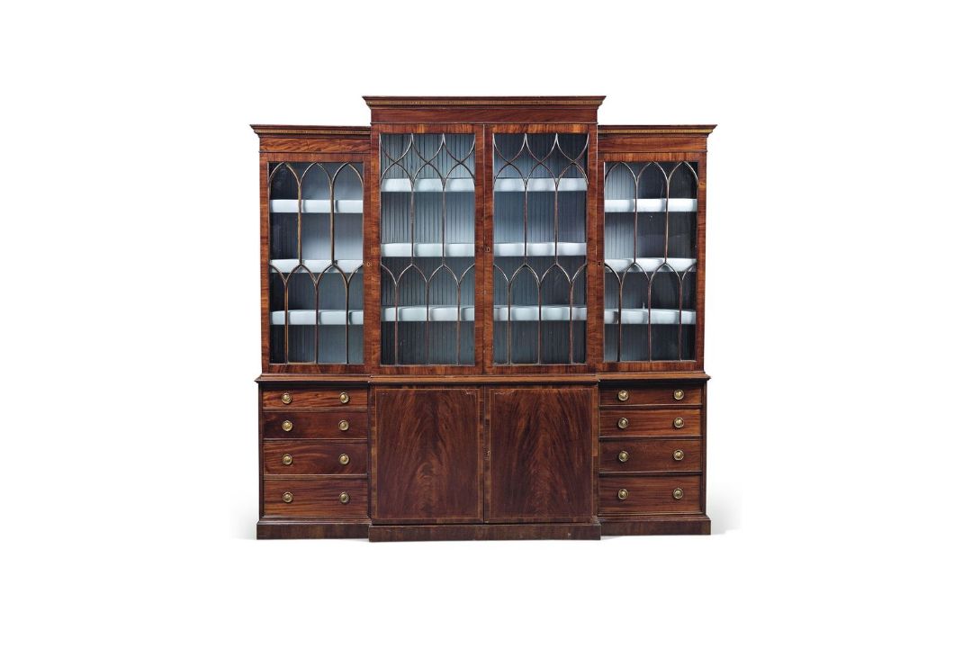 A George III mahogany breakfront library bookcase, late 18th century, the moulded and inlaid