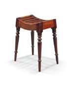 A Regency mahogany stool, early 19th century, the dished, slatted seat on turned legs, 55cm high,