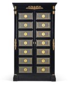 An Empire style ebonised and brass mounted armoire, 20th century, the tooled leather panelled