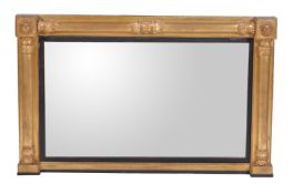 A George IV giltwood and composition overmantel mirror, circa 1825, with ebonised slip and plinth