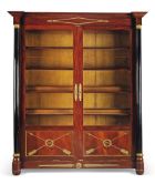 A pair of Empire style mahogany and ebonised display cabinets, late 19th century, the canted