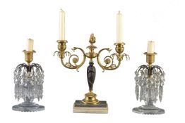 A pair of Regency cut glass and gilt and patinated bronze lustre candlesticks