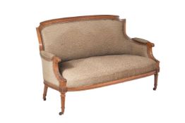 A walnut and upholstered canape in Louis XVI style
