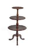 A mahogany three tier dumb waiter in George III style