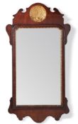 A George II walnut and parcel gilt wall mirror, circa 1750