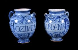 A pair of central Italian maiolica Berettino-ground wet-drug jars, late 17th century