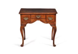 A George I walnut and feather banded side table, circa 1720