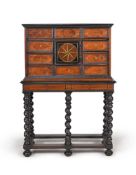 ϒ A Flemish walnut, ebonised and ivory inlaid cabinet on stand, possibly Antwerp