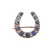 A late Victorian sapphire and diamond horseshoe brooch
