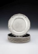 A set of twelve George III silver dinner plates by Robert Sharp
