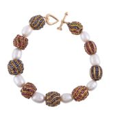 A freshwater cultured pearl, ruby, sapphire and emerald bracelet by Natalia Josca