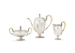 A German silver and ivory circular pedestal three piece coffee service by Gebrüder Weyersberg