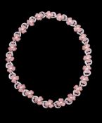 A pink sapphire and diamond flower head necklace