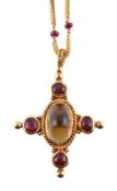 A rock crystal and ruby cross pendant by Natalia Josca