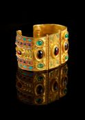 ϒ A gold coloured multi gem set bangle by Natalia Josca