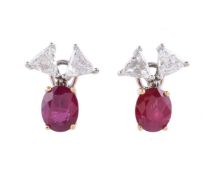 A pair of diamond and ruby earrings