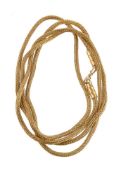 A handmade gold coloured foxtail link necklace by Natalia Josca the chain composed of woven gold col