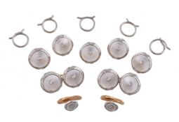 An early 20th century mother of pearl and diamond dress set