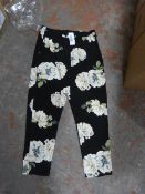 *Sixteen Pairs of Black Floral Trousers (Various S