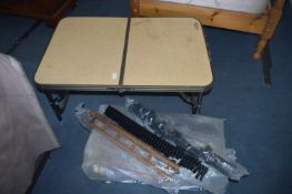 Bag Containing CD Storage Racks and a Folding Camping Table