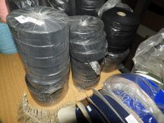 Twenty Six Rolls of Black Satin Ribbon