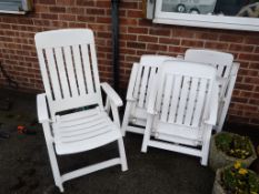 Four White Plastic Garden Chairs