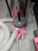 *Two Pink Parasols and a Base