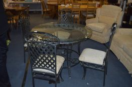 Glass Topped Dining Table with Four Chairs