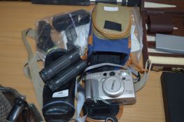 Canon Camera and One Other