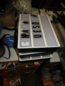 Three Illuminated Signs