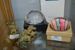 Two Glass Paperweights and a Bronze Effect Chariot