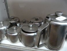 Seven Stainless Steel Water Jugs