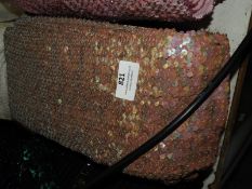 Roll of Salmon Sequin Fabric