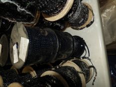 Six Rolls of Silver Sequins on Black Thread