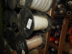 Four Rolls of White Braided Thread