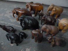 Box of Thirteen Small Wooden Elephants